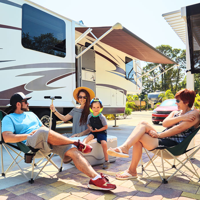Family and friends enjoying their time on their lot at RV park in College Station