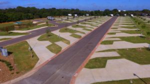 Aerial view of the spacious concrete RV lots at Hardy's Resort RV Park in College Station, Texas.