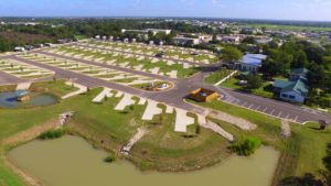 Aerial view of the spacious concrete RV lots at Hardy's Resort RV Park in College Station, Texas.