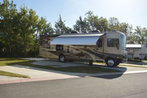 RV parked in spacious concrete lots at Hardy's Resort RV Park in College Station, Texas.